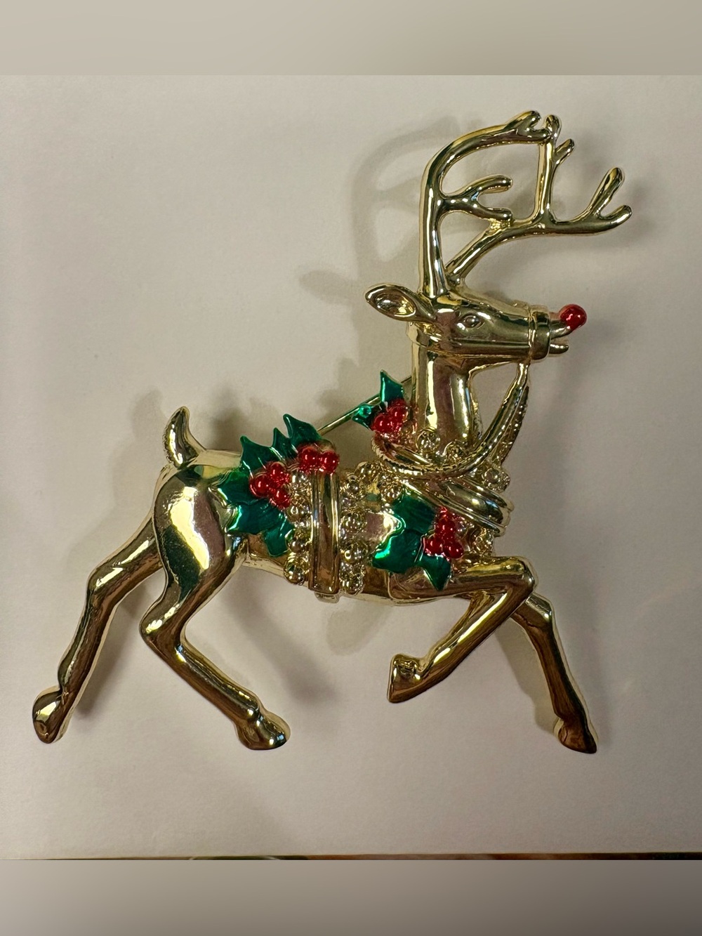 Gold-tone reindeer lapel pin